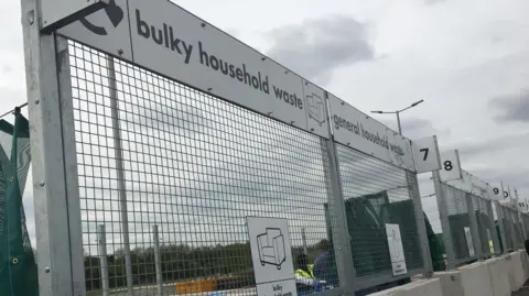 Thorn Turn Household Recyling Centre, showing a sign for scrap metal, netting, and barriers.