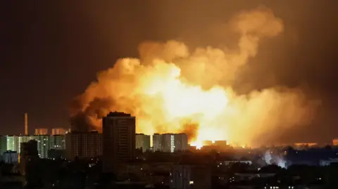 Explosions light up the night sky over Ukrainian capital Kyiv following a major Russian missile and drone attack 