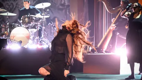 PA Media Florence and the Machine during filming for the Graham Norton Show