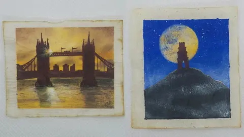 PA Media Two teabags - one has Tower Bridge painted on it, whilst the other has Glastonbury Tor on it. Both are in silhouette. Tower Bridge has a golden sky, reflected back in the water below, and Glastonbury Tor stands in front of a golden moon and deep blue sky.