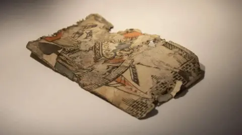 Chatham Historic Dockyard Trust A badly damaged playing card