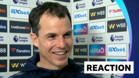 Regis Le Bris smiling during post match interview