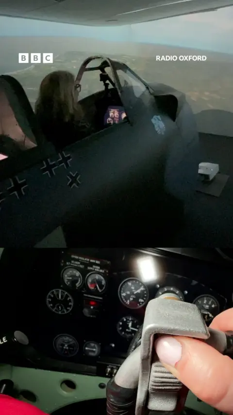 A woman in a Spitfire simulator