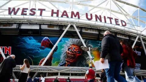 General view outside the stadium as fans arrive prior to the Premier League match between West Ham United and Leeds United at the London Stadium. 