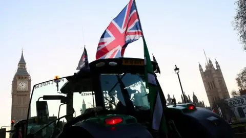 Reuters A tractor flies a Union Jack Flag near the near the Elizabeth Tower