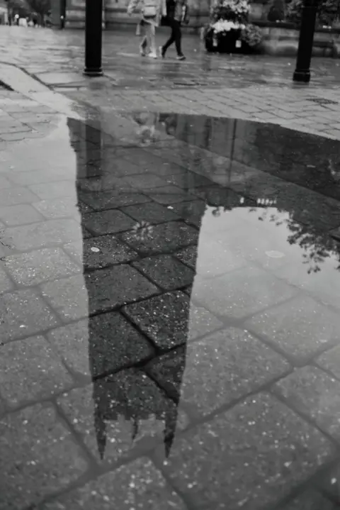 Kayla Hackney A photograph of a reflection of Derby Cathedral taken in a puddle 