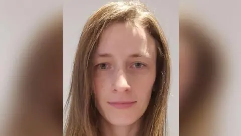 Lincolnshire Police A head and shoulders picture of Kristine Sparane - she has blue eyes and light brown shoulder-length hair