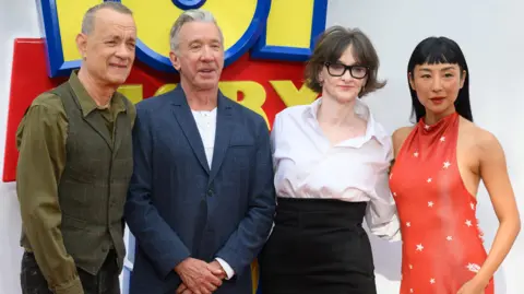 Getty Images Tom Hanks, Tim Allen, Joan Cusack and Greta Lee pictured together at the premiere of Toy Story 5