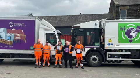 Councillor Stewart Eaves with Hyndburn Council Waste Services Officers and the new bin wagons