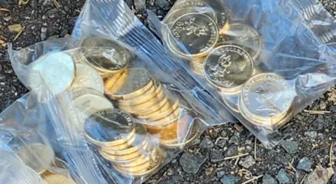 NEW SOUTH WALES POLICE FORCE Plastic bags of the stolen one dollar coins