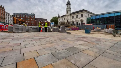 New paving being laid in Leicester Market Place