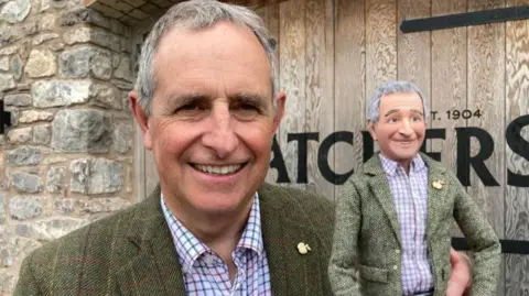 BBC Martin Thatcher holding a small model of himself