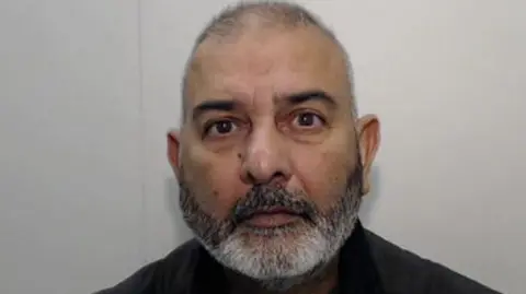 A mugshot of Mohammed Zahid 