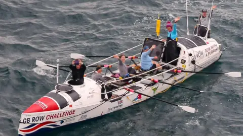 GB Row Challenge A drone image of the all female crew, Team Ithaca, on their boat at sea.