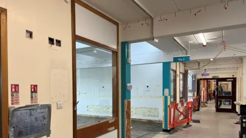 Qays Najm/BBC A hospital ward and corridor stripped out for repairs.