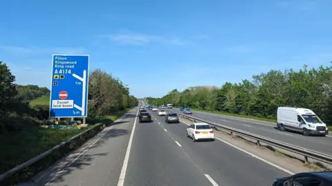 An image of the M32 motorway with a sign showing the junction to Filton, Kingswood and the ring road.