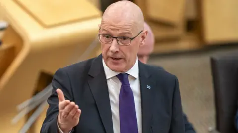 PA Media First Minister John Swinney 