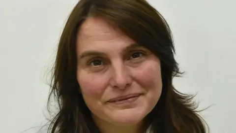 Loretta Locke Profile photo of a woman with dark brown hair 