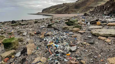 Daniel Hogburn Action from waves is washing out the waste 