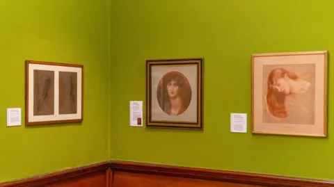Bradford Museums and Galleries Three portrait paintings in an art gallery. The background wall is green, there is wood panneling below