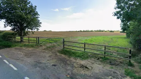 A field behind a fence