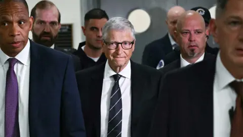 Microsoft co-founder Bill Gates (C) arrives for a closed-door interview with the House Oversight Committee on Capitol Hill in Washington, DC, on June 10, 2026.