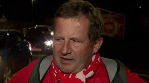 Simon Knox on the street outside the ground