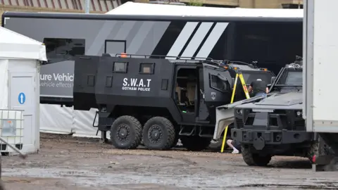 PA Media A large black truck, with SWAT - GOTHAM POLICE written in white letters on the side.