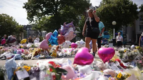 Flowers and tributes outside the Atkinson Art Centre Southport