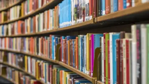 Getty Images Library shelves stacked with colourful rows of books