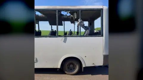 A destroyed minibus