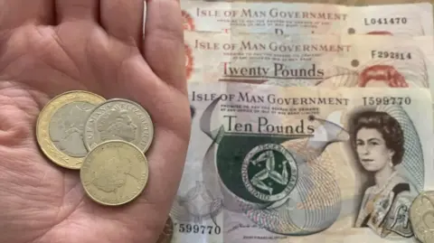BBC Hand holding Manx money