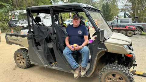 The Green Valley Fire Chief sat in the vehicle