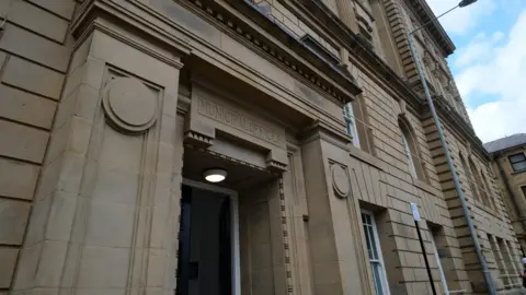 LDRS A Georgian-style municipal building on a clear day