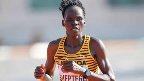 Alamy Rebecca Cheptegei takes part in the marathon at the World Athletics Championships in Budapest 2023