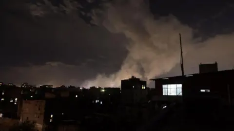 EPA Smoke from an air strike rises of Saana, the capital of Yemen