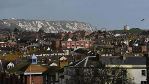 A view over Folkestone. There are white chalk cliffs in the background.