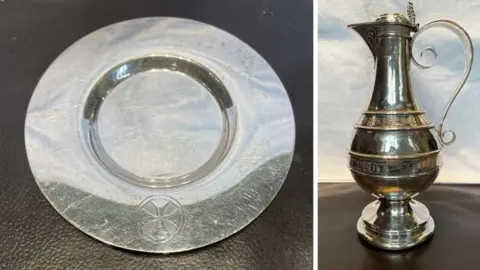 St Margaret of Antioch Church PCC A silver plate on the left and a silver communion flagon on the right. Both items were stolen from a church.