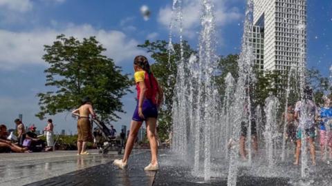 Children play at splash pad in New York City