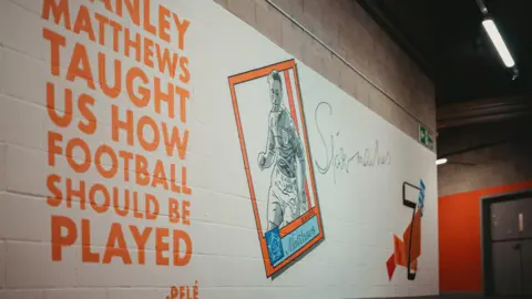 Blackpool FC A section of the Stanley Matthews mural has a tribute to Matthews from football giant Pele the Brazilian forward giant Pele in tangerine lettwres on a white background.