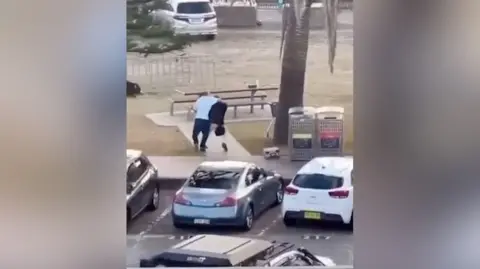 Man in white shirt tackles gunman 