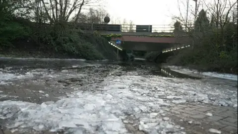 BBC Ice and puddles can be seen leading up to and underneath the underpass