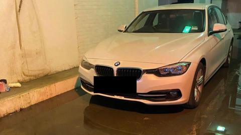 BMW car in flooded basement