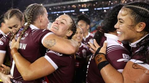 Ali Brigginshaw of the Maroons and Keilee Joseph of the Maroons embrace after winning game two of the Women's State of Origin series