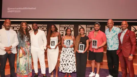 Getty Images Actors from A Song from the Dark at the American Black Film Awards in 2023