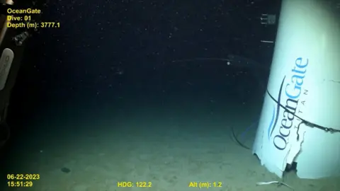 US Coast Guard A wide shot from a deep sea submersible's CCTV camera showing the wreckage of another submersible vehicle.