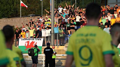 Caernarfon fans applaud their players following the second leg loss to Legia Warsaw