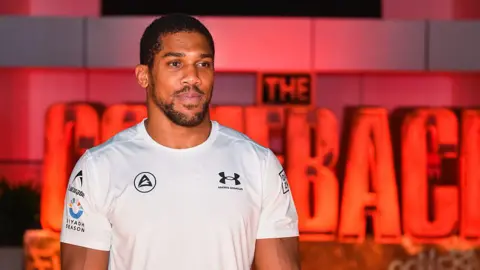 Anthony Joshua looking on 