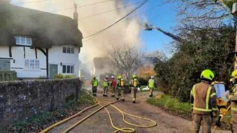 A house on fire at Smithfield End, Swanbourne, Buckinghamshire