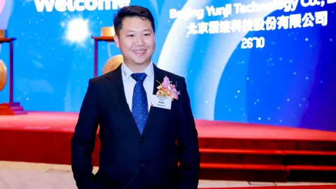 Yunji Chinese businessman Xie Yunpeng wearing a smart suit and tie